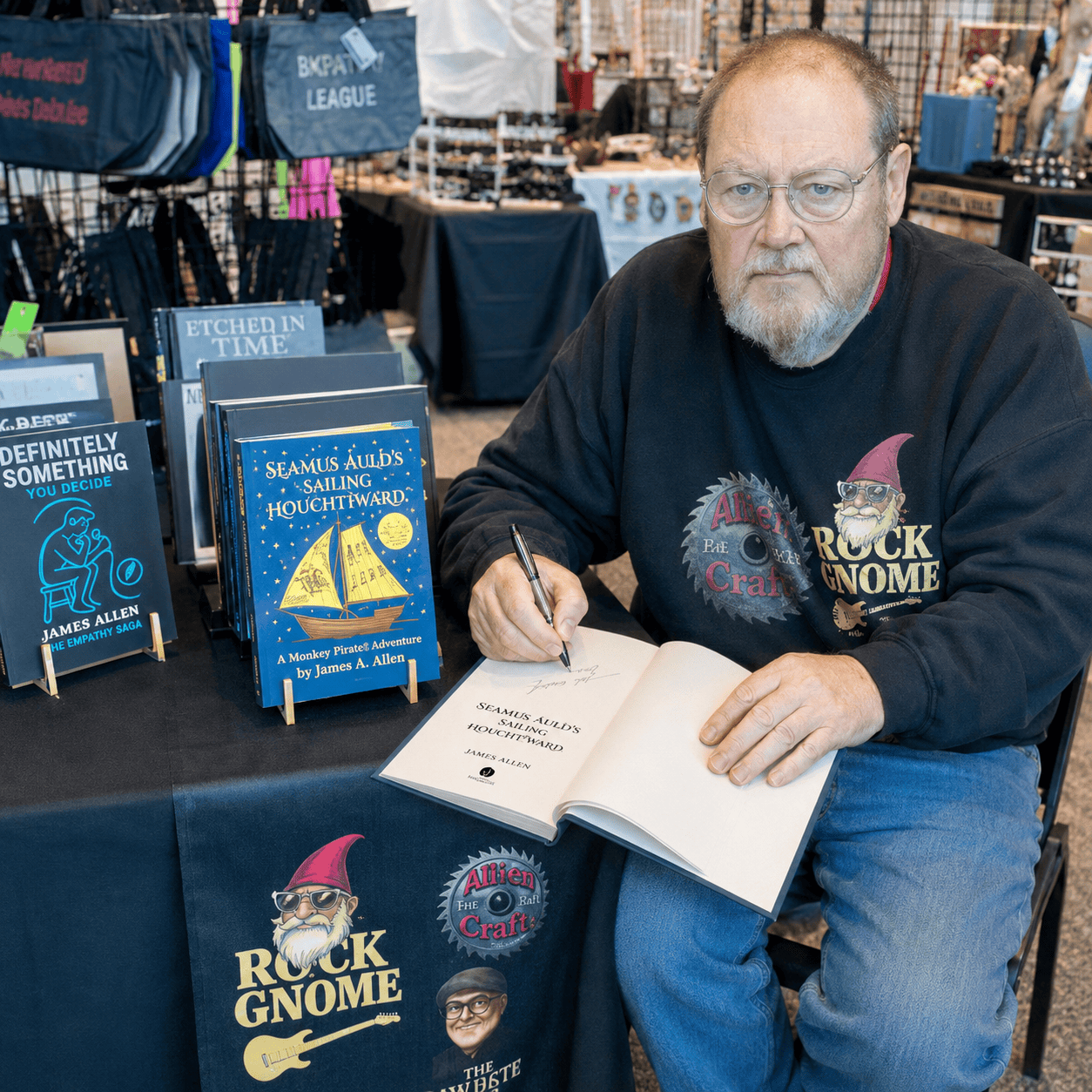 Signing books at a vendor event
